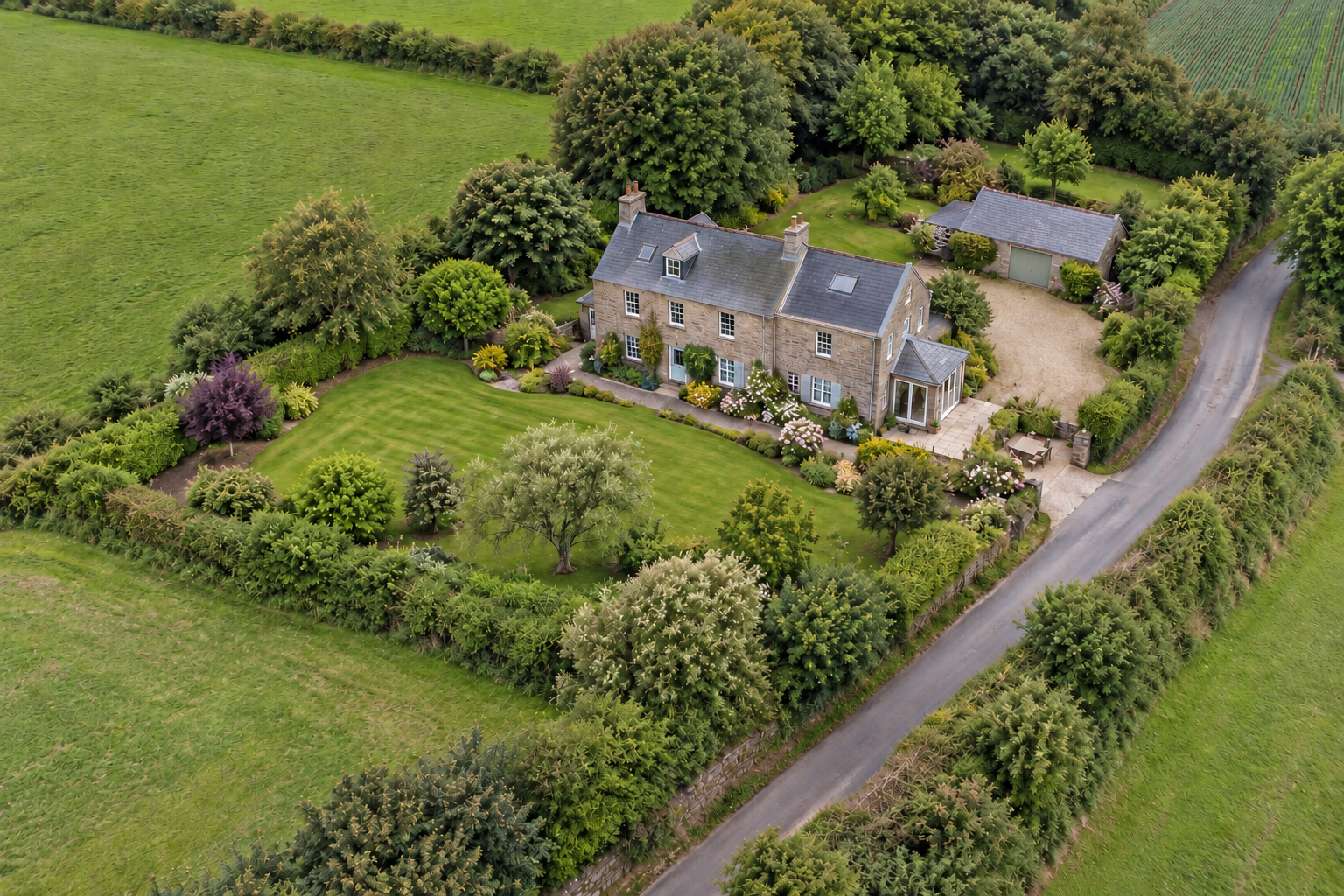 Conceptual aerial view of a generic, invented country home surrounded by fields and hedges.
